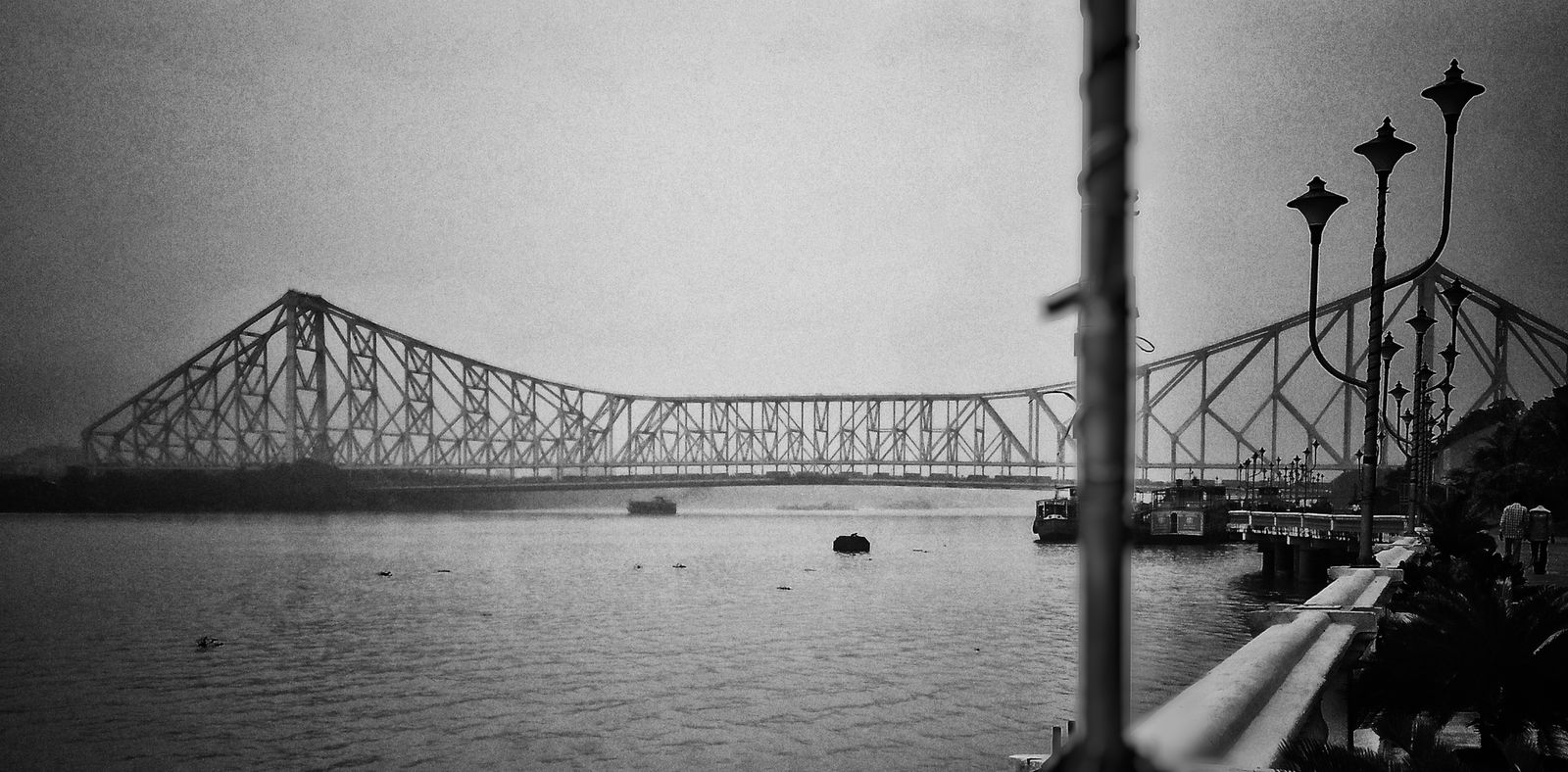Howrah Bridge over the Hooghly river in Kolkata, in black and white